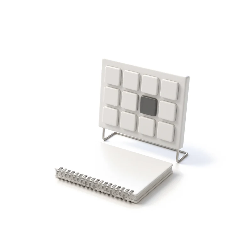 A ceramic status board of square tiles on a steel stand, one tile graphite, a spiral-bound ceramic ledger in front.