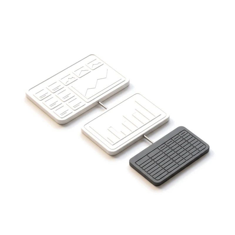 Three ceramic screen panels joined by steel rods — metric cards, then a bar chart, then a graphite table.