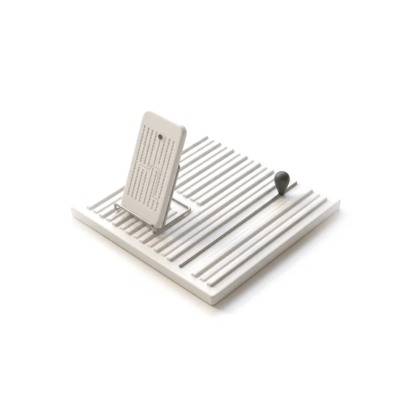 A ceramic phone beside vineyard rows, a steel path leading between them to a graphite marker.
