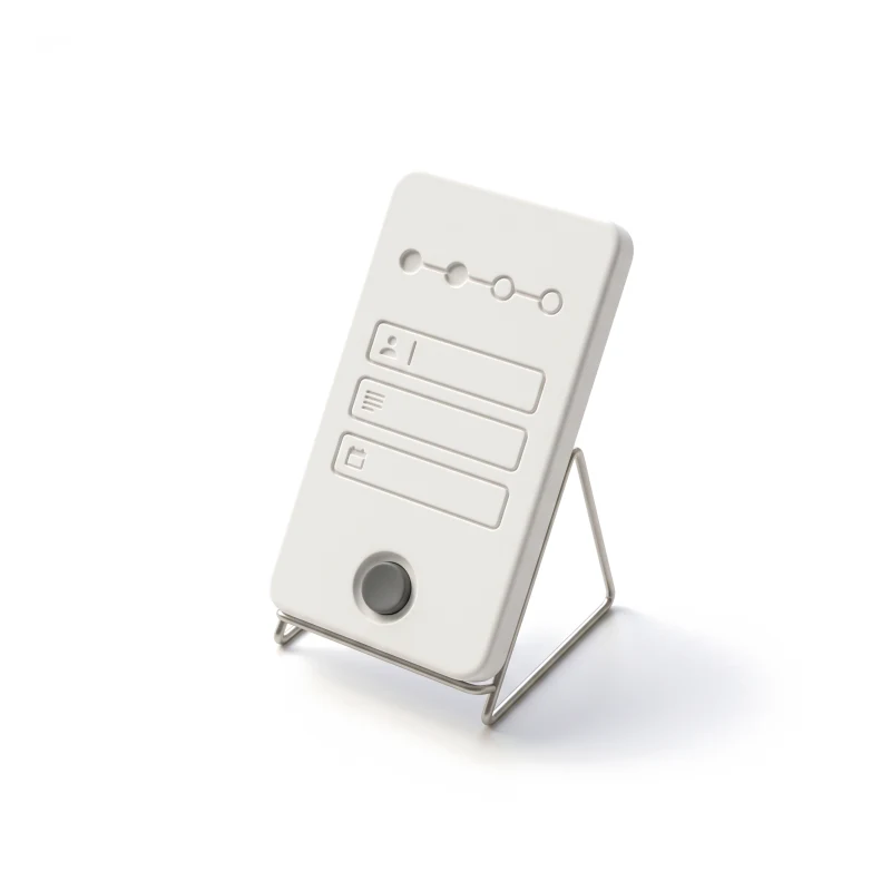 A white ceramic phone on a thin steel stand, carved with a short form under a step bar, a round graphite key at its foot.