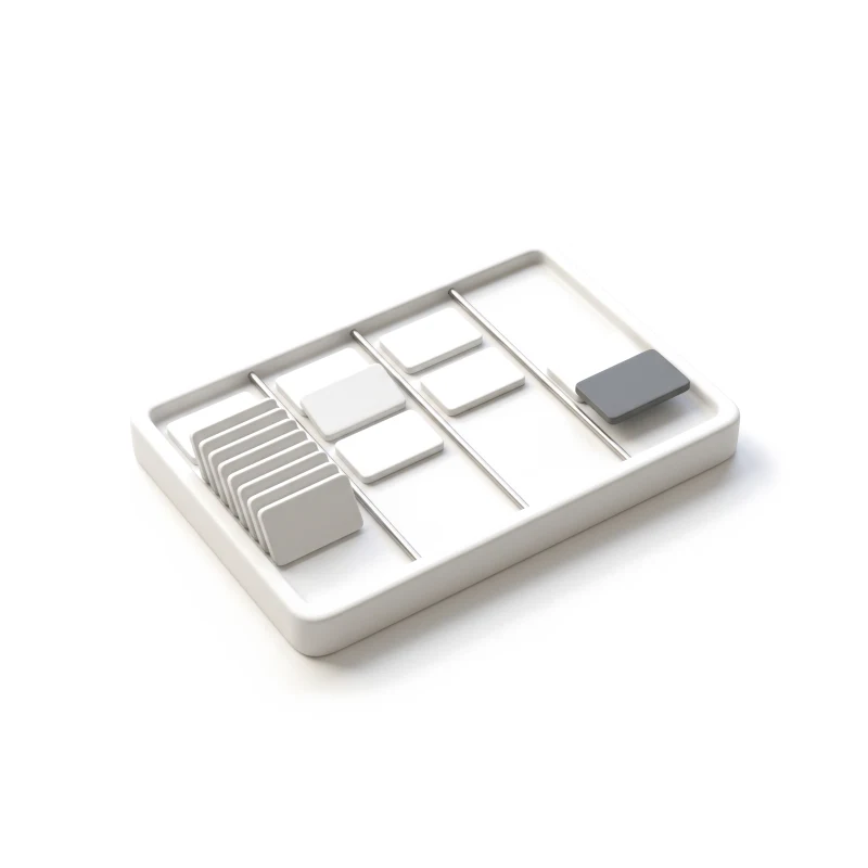 A white ceramic board with four shallow columns of small cards, one graphite card moving into the last column.