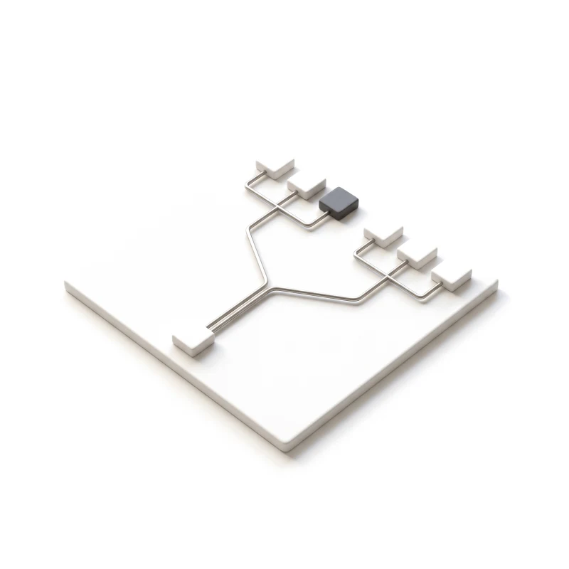 A ceramic board with steel rails branching from one start block into two paths and three end blocks, one of them graphite.