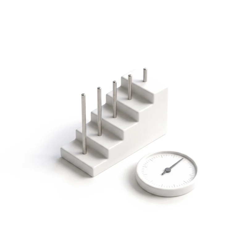 A white ceramic staircase with a steel peg on each step, beside a round ceramic gauge with a graphite needle.