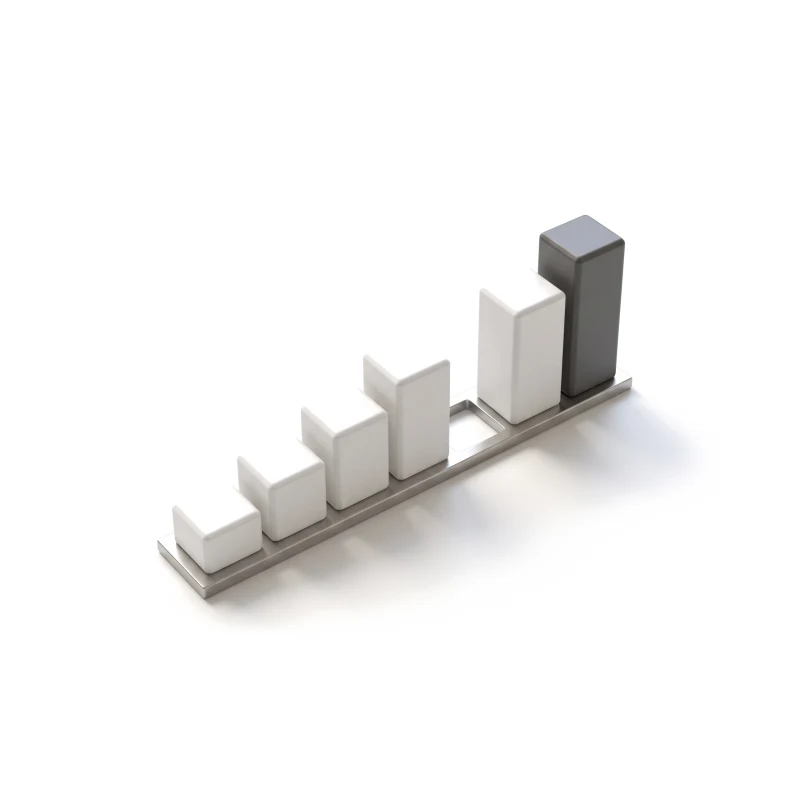 A row of ceramic bars rising on a steel rail with one gap, the tallest bar in graphite.