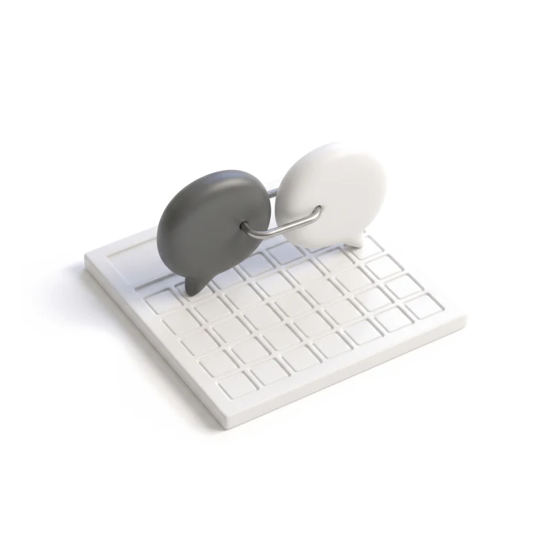 Two ceramic speech bubbles joined by a steel link on a ceramic calendar tile, one bubble graphite.