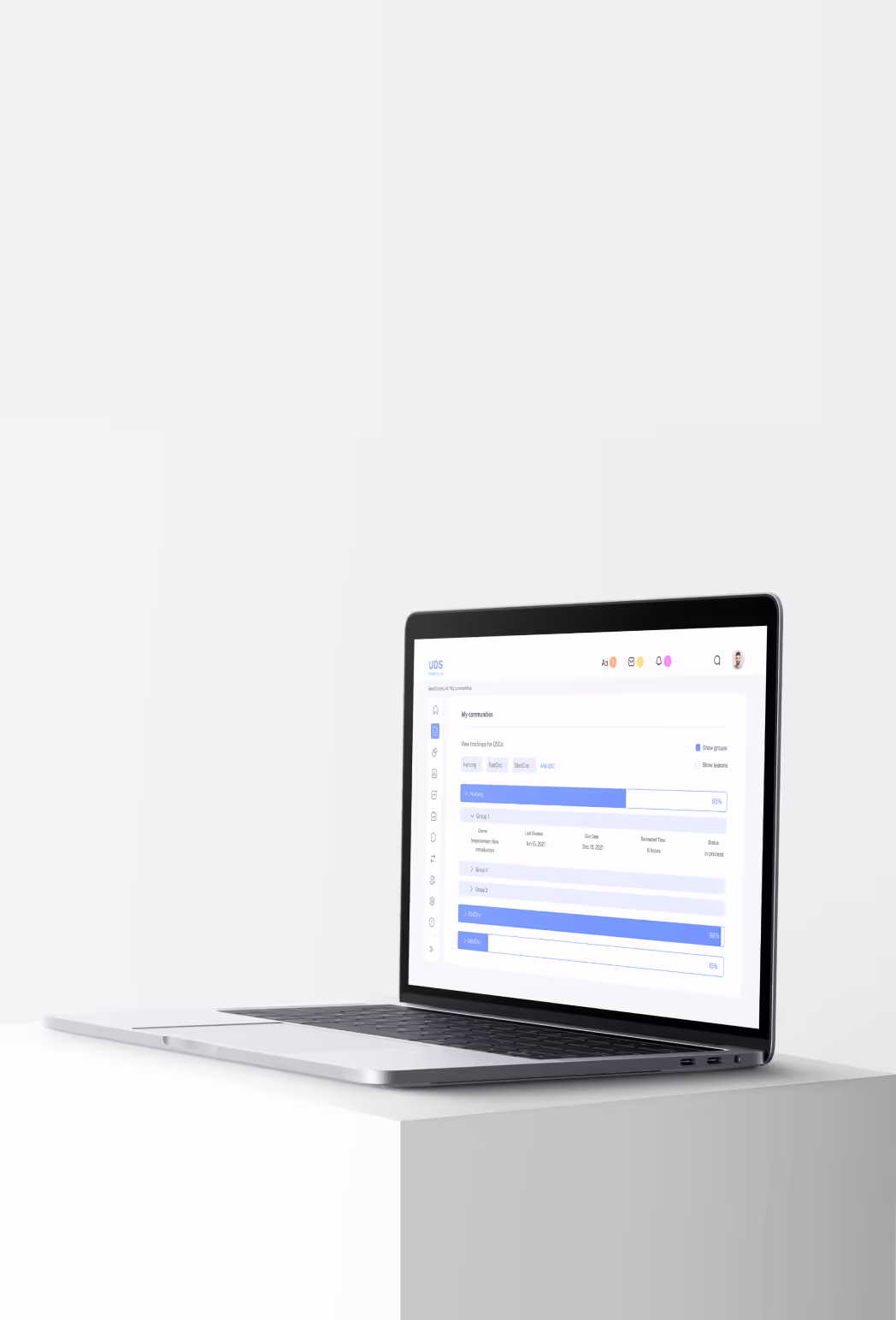 A laptop placed on a white table, set against a blue and white background.